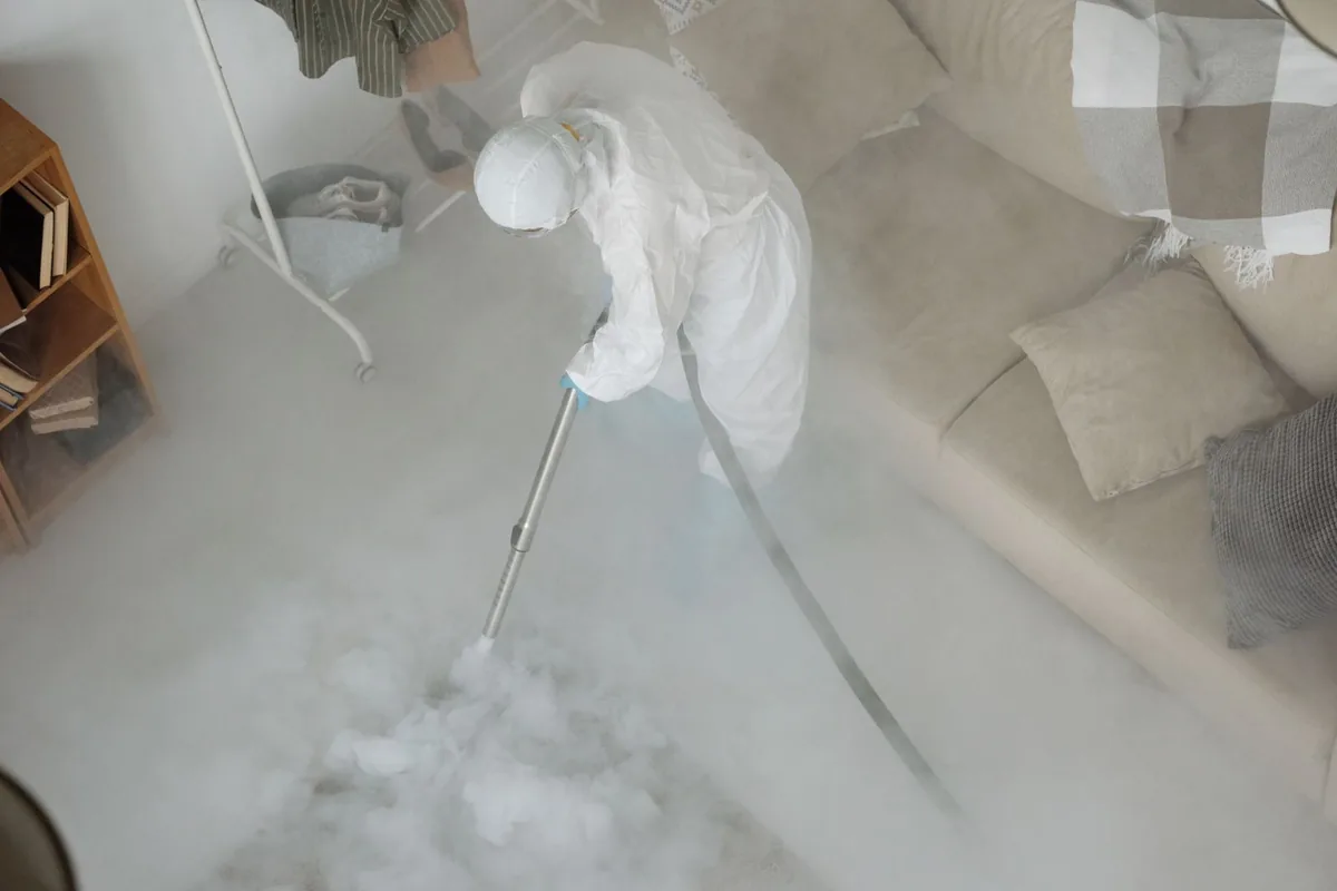 Biohazard cleanup technician in protective equipment, Bellport, NY